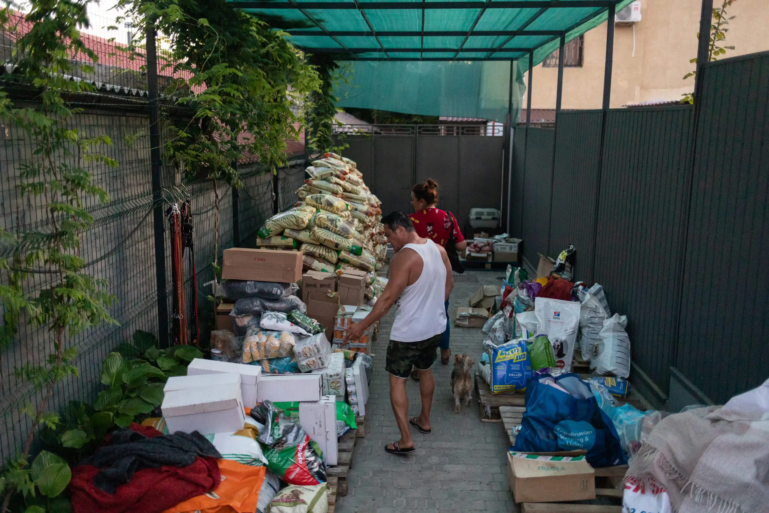 The outside of Anna Kurkurina’s home is lined with animal food and humanitarian supplies.