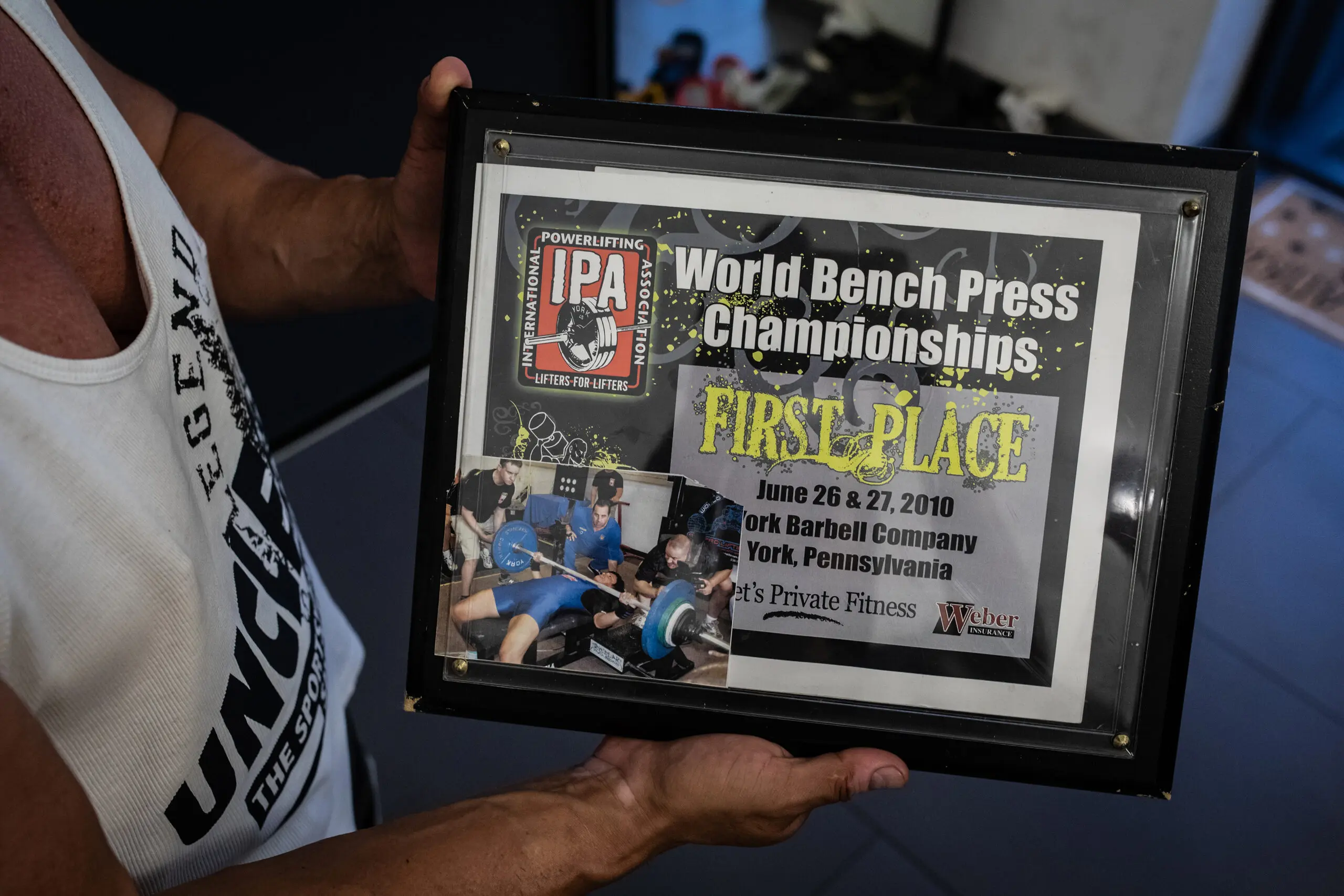 Anna Kurkurina holds a plaque she received after winning the 2010 IPA (International Powerlifting Assocation) World Bench Press Champtionships; the event was held during the summer of 2010 in York, Pennsylvania.